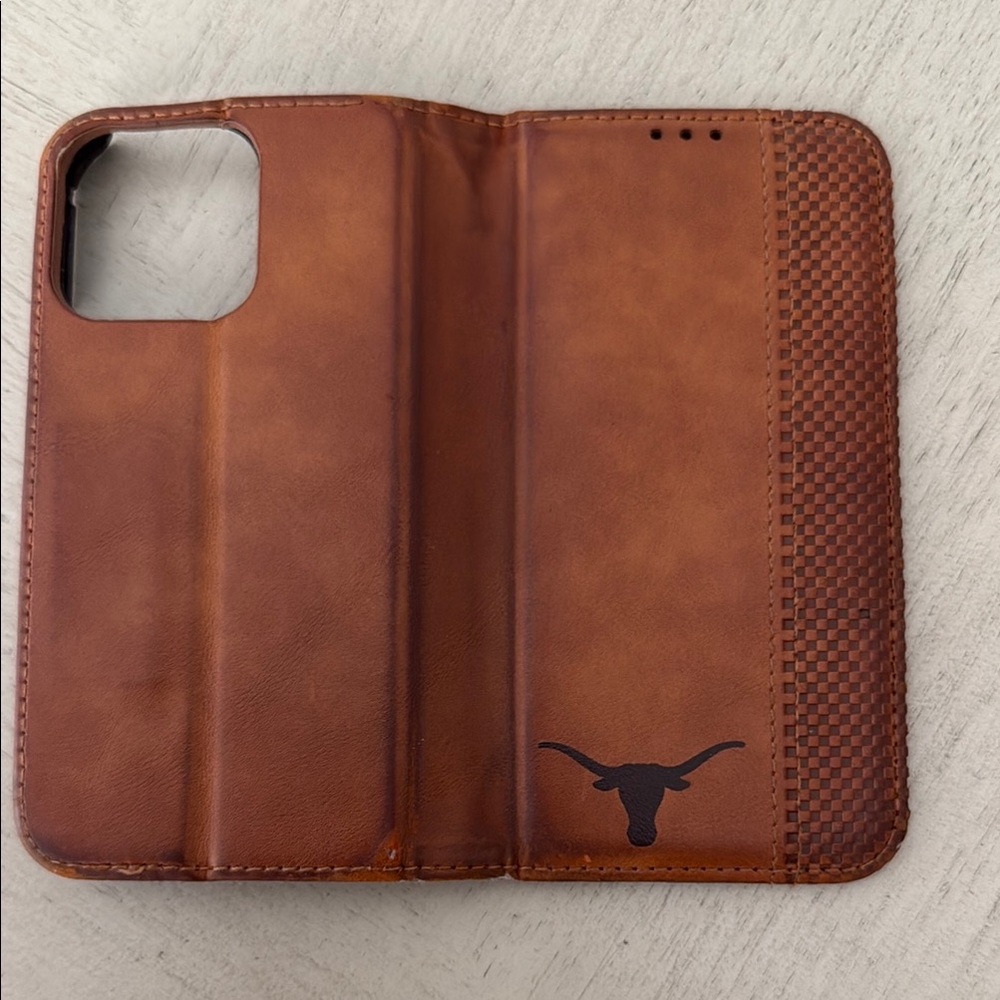 Brown Leather Phone Case with Longhorn Logo for iPhone 13 Pro.